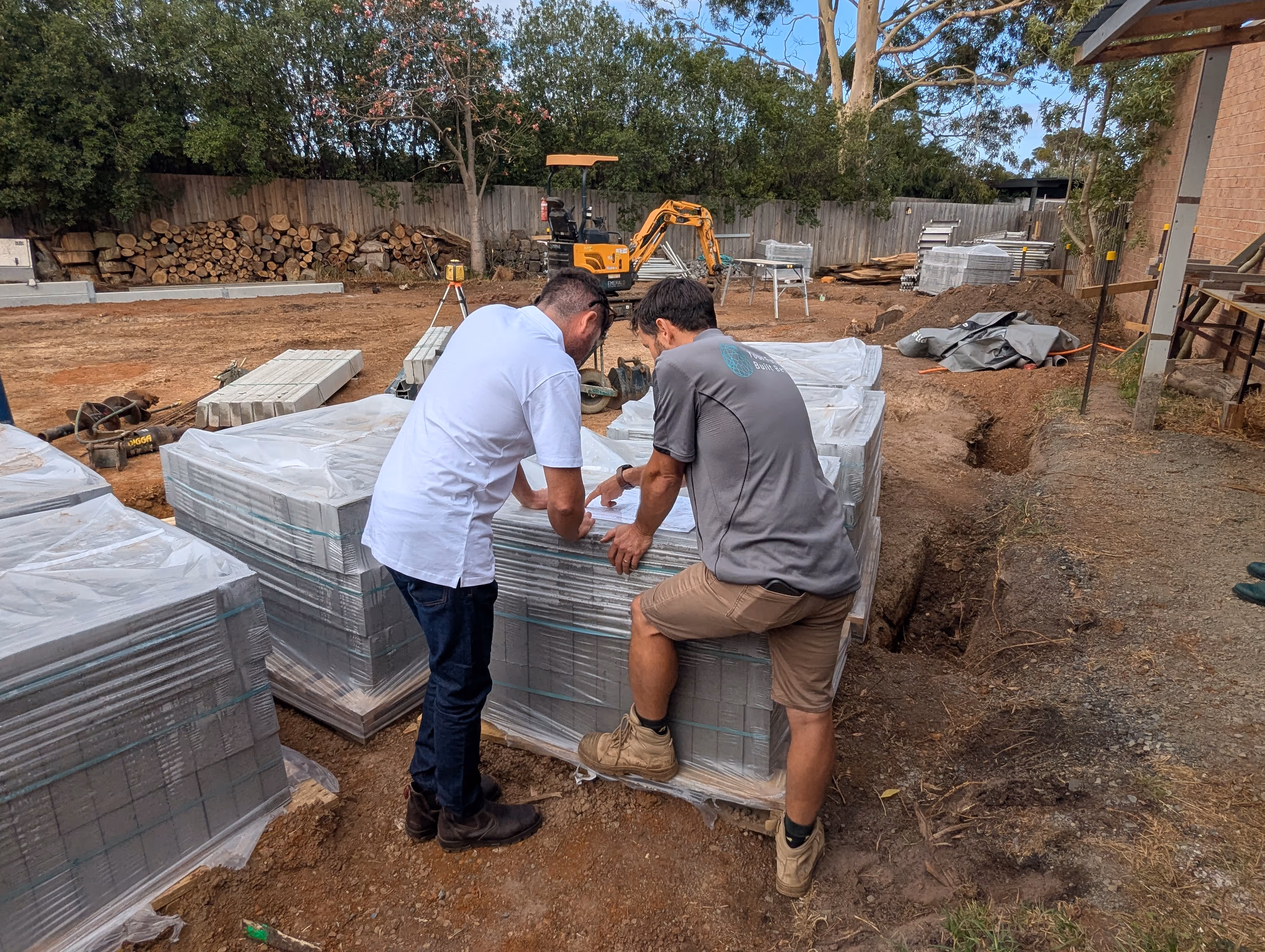 Foreman planning site safety setup on a construction site