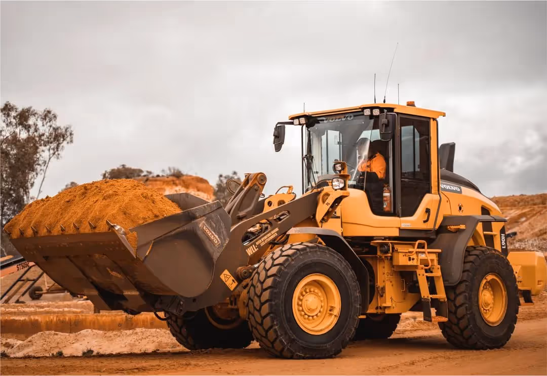 Heavy plant machinery - bulldozer with a load of dirt